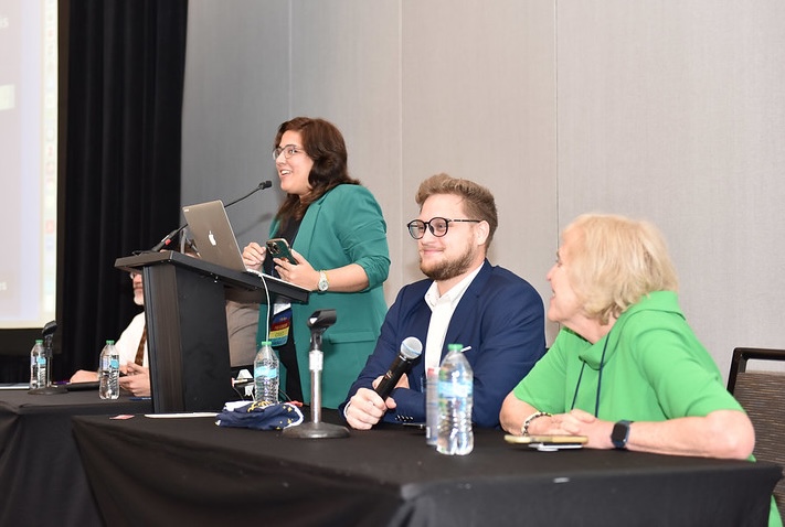 A panel of three presenters during a session at OLC Accelerate 2024.